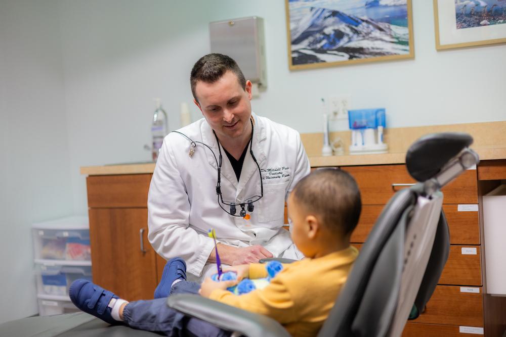 Dr. Mitchell talking to child patient, west chester oh