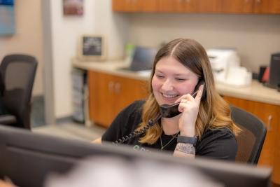 Front desk lady talking on the phone, west chester oh