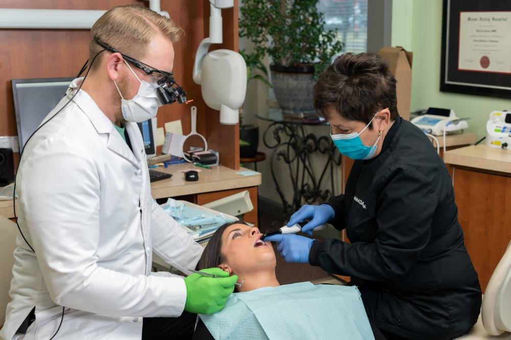 Dr. Brian Ceasar with a patient, west chester oh