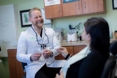 Dr. Caesar laughing with patient, west chester oh