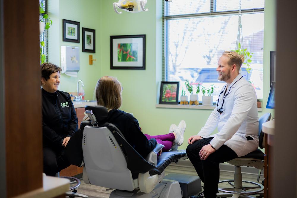 Dr. Caesar talking with younger patient, west chester oh