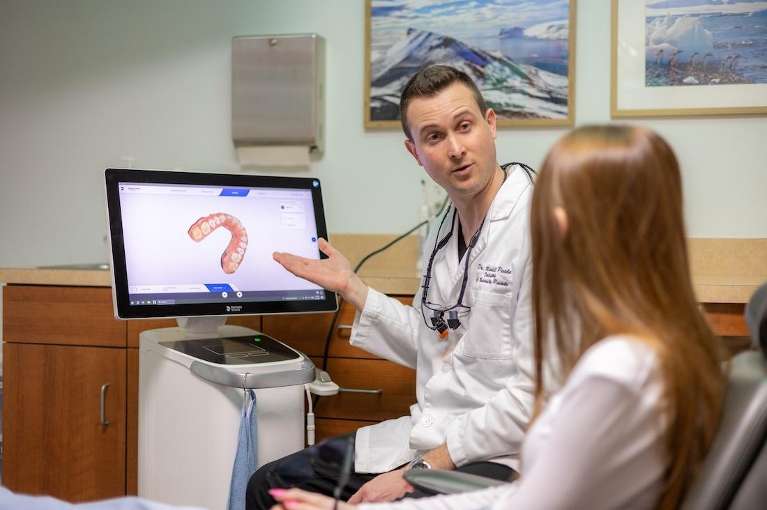 Dr. Mitchell Poole showing a digital impression to a patient at dentistry @ university pointe in west chester, oh